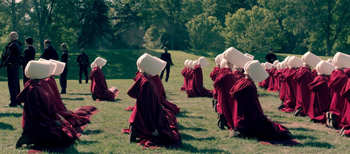 A screencap of the Handmaids from Hulu's The Handmaid's Tale.
